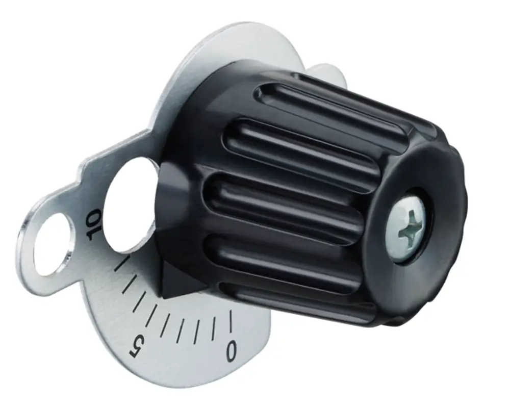 Oventrop Einstellgruppe mit schwarzem verstellbarem Knopf und Skala zur manuellen Anpassung. Gehäuse aus Metall mit Markierungen für die Einstellwerte.